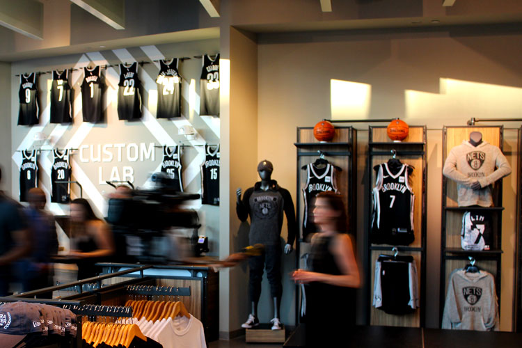 The Barclays Center team store moves to Flatbush Ave. and changes its name:  from Nets Shop by Adidas to Swag Shop to (apparently) Brooklyn Style